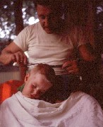 S1528 man giving boy haircut